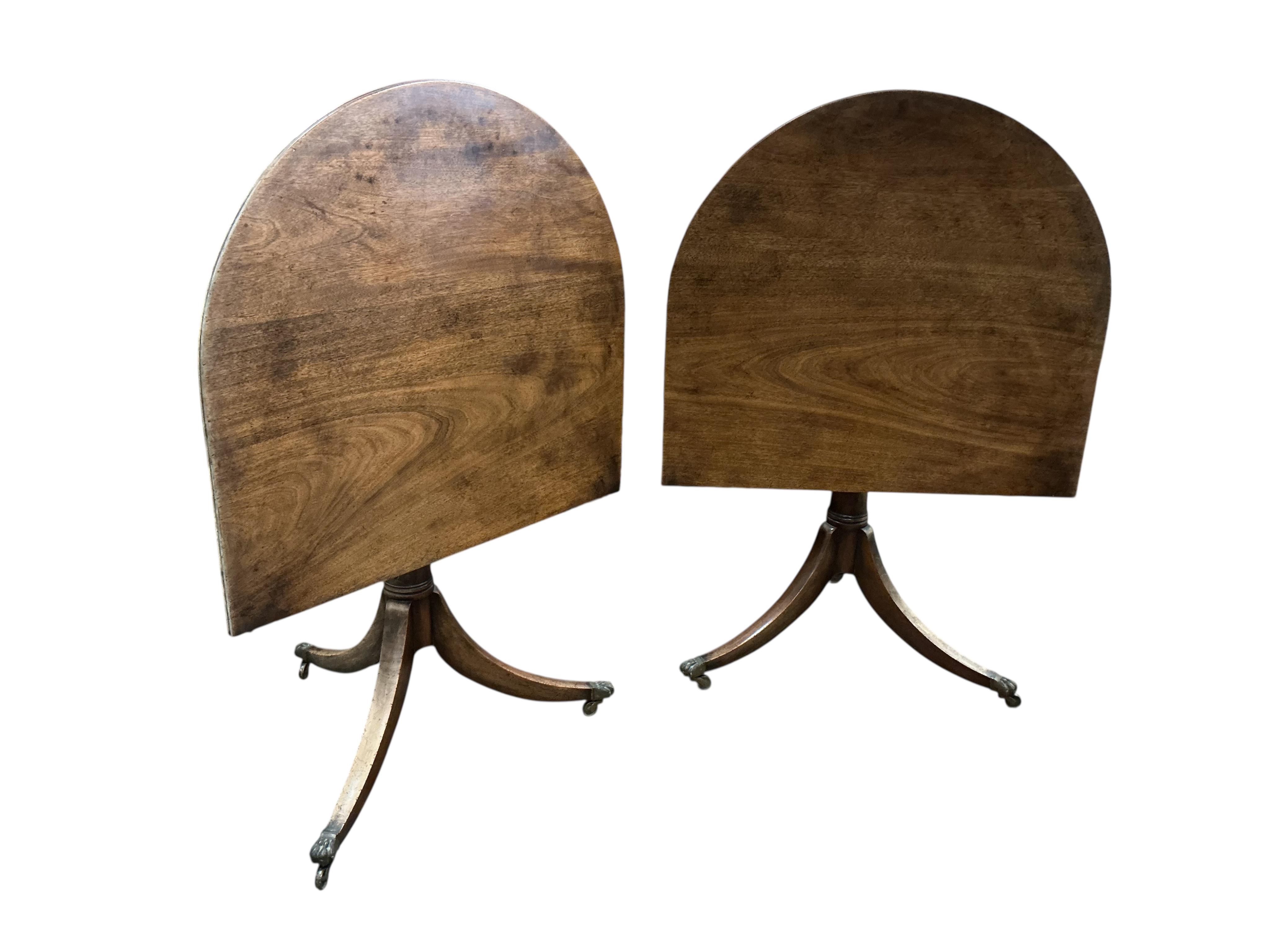 A George III style mahogany twin pillar 'D' end extending dining table, width 260cm extended, two spare leaves, depth 91cm, height 72cm
